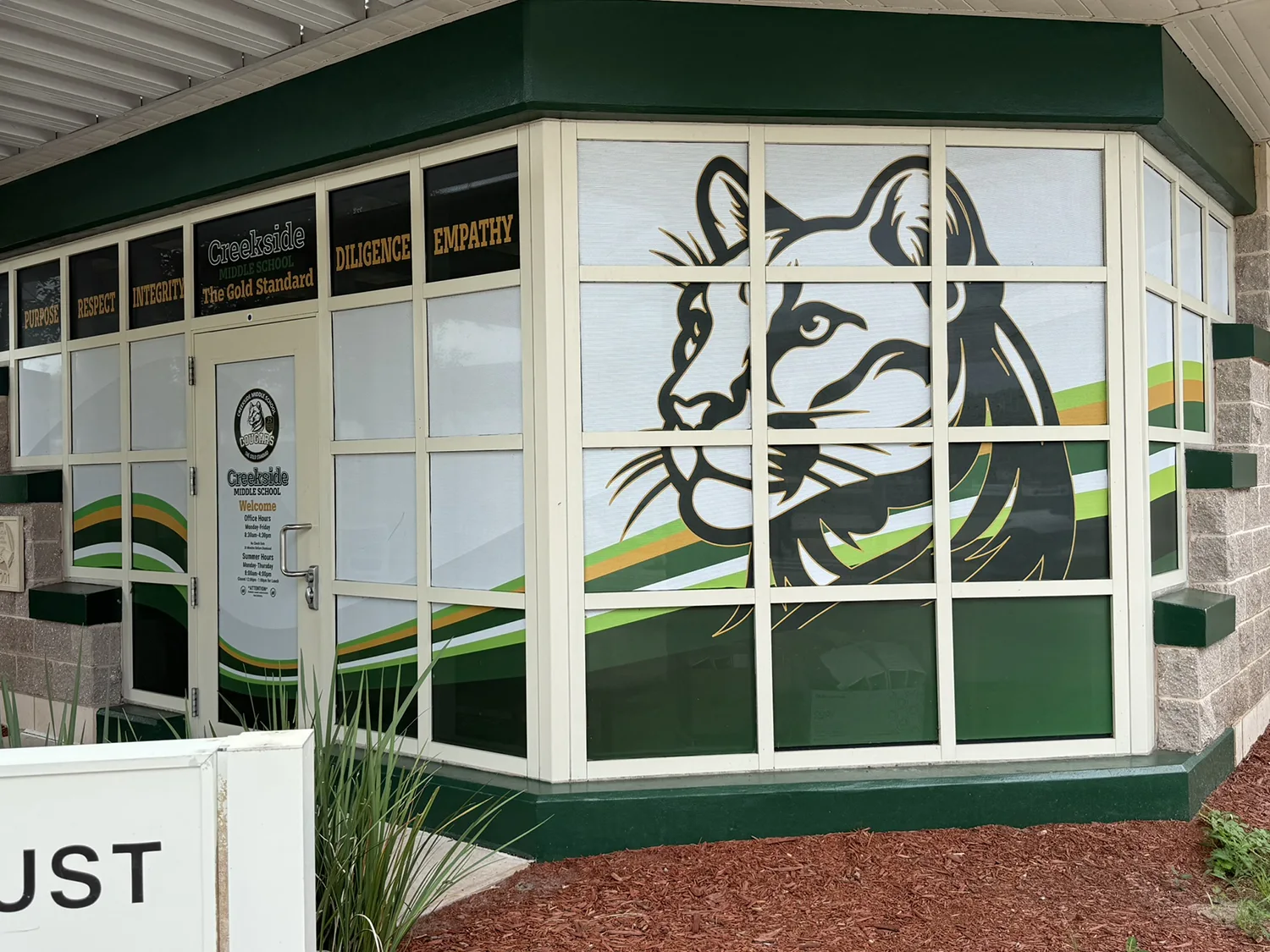 A presentation showing the logo on the school building.